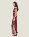 One-shoulder knit maxi dress with multi-directional stripes, twisted off-shoulder strap, and side leg split.
