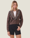 Brown women's fringe cardigan featuring long sleeves, statement fringe detailing, and a classic button-down front.