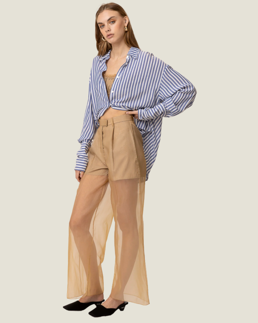 These Elfreda Sheer Overlay Wide Leg Pants are modern capsule wardrobe pieces, that feature a sheer bottom, high waist, and belt loops.