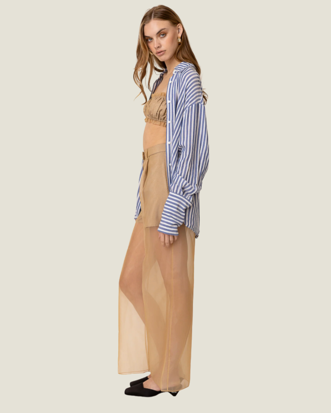 These Elfreda Sheer Overlay Wide Leg Pants are modern capsule wardrobe pieces, that feature a sheer bottom, high waist, and belt loops.