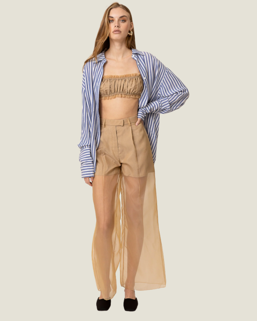 These Elfreda Sheer Overlay Wide Leg Pants are modern capsule wardrobe pieces, that feature a sheer bottom, high waist, and belt loops.
