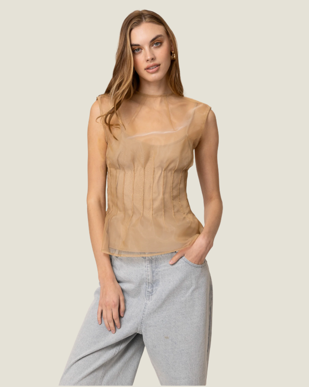 Elfreda Sheer Sleeveless Pleated Blouse is a modern capsule wardrobe piece with a round neck line & flattering length!
