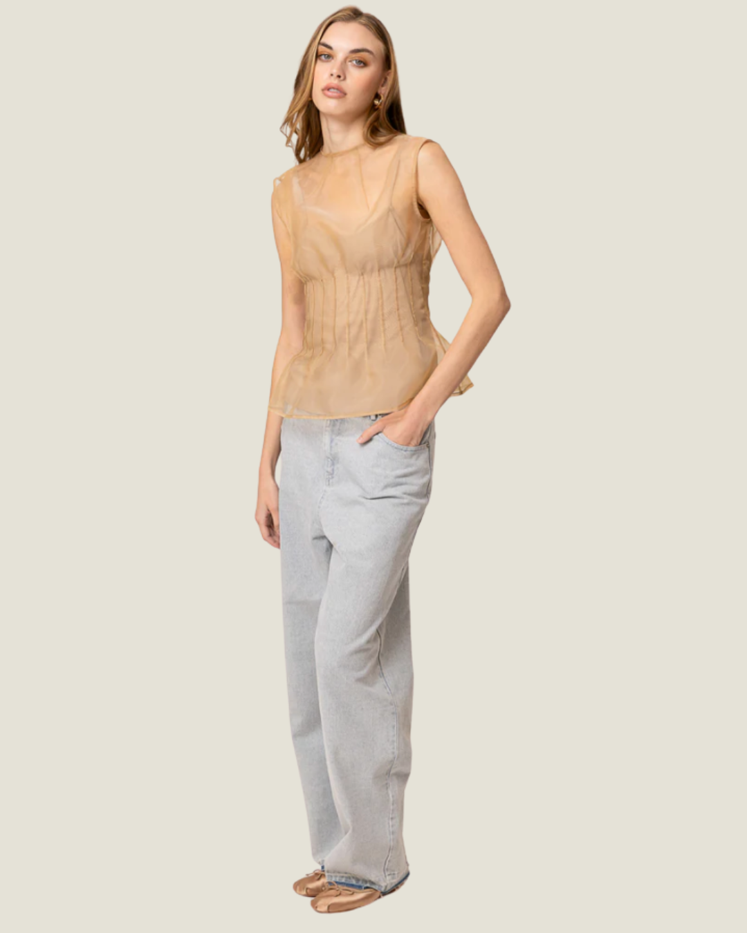 Elfreda Sheer Sleeveless Pleated Blouse is a modern capsule wardrobe piece with a round neck line & flattering length!