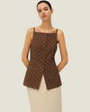 The Elise Polka Dot Top is designed with a square neckline, button down front, polka dots, and front v-neck it is a timeless women’s wardrobe staples.