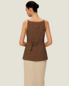 The Elise Polka Dot Top is designed with a square neckline, button down front, polka dots, and front v-neck it is a timeless women’s wardrobe staples.